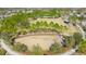 Aerial view of a community park with a dog park, walking paths, and lush landscaping at 3898 Barbour Trail, Odessa, FL 33556