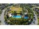 Community pool and playground surrounded by trees at 3898 Barbour Trail, Odessa, FL 33556