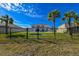 Private backyard with a pool and black metal fence at 3898 Barbour Trail, Odessa, FL 33556