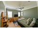 Cozy bedroom with green walls, a queen bed, and TV at 3898 Barbour Trail, Odessa, FL 33556