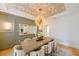 Formal dining room showcasing a gorgeous chandelier and modern decor at 3898 Barbour Trail, Odessa, FL 33556