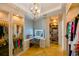 Elegant dressing room with vanity, mirror, and custom shelving at 3898 Barbour Trail, Odessa, FL 33556