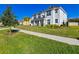 Two-story house with white siding, gray roof, and landscaped yard at 3898 Barbour Trail, Odessa, FL 33556