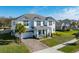 Two-story home with gray roof, white siding, and landscaping at 3898 Barbour Trail, Odessa, FL 33556