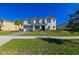 Two story house, white siding, gray roof, paver driveway, landscaped yard at 3898 Barbour Trail, Odessa, FL 33556