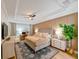 Serene main bedroom with a plush bed, wood accent wall and ceiling fan at 3898 Barbour Trail, Odessa, FL 33556