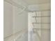 Walk-in closet featuring white wire shelving, offering plenty of storage space at 4208 Winding Moss Trl # 102, Tampa, FL 33613