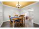 Dining room with wood table and chairs, and a chandelier at 4424 W Bay Villa Ave, Tampa, FL 33611