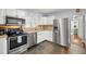 Modern kitchen with stainless steel appliances and white cabinets at 4424 W Bay Villa Ave, Tampa, FL 33611