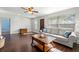 Living room with hardwood floors, light walls and a comfy sofa at 4424 W Bay Villa Ave, Tampa, FL 33611