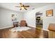 Bright living room with hardwood floors and view into kitchen at 4424 W Bay Villa Ave, Tampa, FL 33611