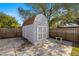 Large storage shed in backyard with double doors at 4424 W Bay Villa Ave, Tampa, FL 33611