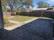 Spacious backyard with brick pavers and wooden fence at 4619 W Bay Villa Ave, Tampa, FL 33611