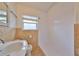 Clean bathroom with tile shower and updated vanity at 4619 W Bay Villa Ave, Tampa, FL 33611