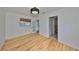 Bright bedroom with hardwood floors and access to a bathroom at 4619 W Bay Villa Ave, Tampa, FL 33611