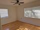 Bright bedroom with hardwood floors and two windows at 4619 W Bay Villa Ave, Tampa, FL 33611