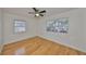 Bedroom with hardwood floors and ceiling fan at 4619 W Bay Villa Ave, Tampa, FL 33611