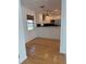 Light and airy dining area with hardwood floors and a view of the kitchen at 4619 W Bay Villa Ave, Tampa, FL 33611