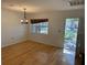 Bright dining room with hardwood floors and view to backyard at 4619 W Bay Villa Ave, Tampa, FL 33611