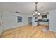 Bright dining room with hardwood floors and kitchen views at 4619 W Bay Villa Ave, Tampa, FL 33611