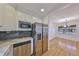 Modern kitchen with stainless steel appliances and white cabinets at 4619 W Bay Villa Ave, Tampa, FL 33611