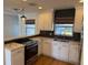 Modern kitchen with white cabinets and quartz countertops at 4619 W Bay Villa Ave, Tampa, FL 33611