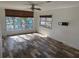 Living room with hardwood floors and large windows at 4619 W Bay Villa Ave, Tampa, FL 33611