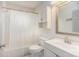 Clean bathroom with white vanity and tub at 5004 Osprey Ln, New Port Richey, FL 34652