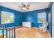 bedroom with wood floors and ceiling fan at 5004 Osprey Ln, New Port Richey, FL 34652