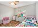 bedroom with pink bed and toys at 5004 Osprey Ln, New Port Richey, FL 34652