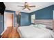 Main bedroom includes a ceiling fan and access to the bathroom at 5004 Osprey Ln, New Port Richey, FL 34652