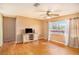 Bright living room with hardwood floors and ceiling fan at 5004 Osprey Ln, New Port Richey, FL 34652