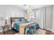 Cozy bedroom with a queen-size bed and unique decor at 5105 W Country Club Dr, Sarasota, FL 34243