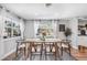 Bright dining room with wooden table and six chairs at 5105 W Country Club Dr, Sarasota, FL 34243