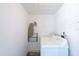 Bright laundry room with washer, dryer, and pegboard at 5105 W Country Club Dr, Sarasota, FL 34243