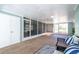 Bright and airy screened porch with seating area at 5105 W Country Club Dr, Sarasota, FL 34243