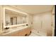 Spa-like bathroom with double vanity, large mirror, and shower at 5120 Marina Way # 21406, Tampa, FL 33611