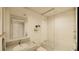 Clean bathroom with a bathtub and glass shower at 5120 Marina Way # 21406, Tampa, FL 33611