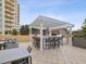 Outdoor kitchen and dining area with pergola cover at 595 5Th Ne Ave, St Petersburg, FL 33701