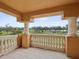 Covered balcony overlooking a park-like setting with water views at 595 5Th Ne Ave, St Petersburg, FL 33701