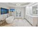 Bathroom boasts a freestanding tub, double vanity, and access to a private balcony at 595 5Th Ne Ave, St Petersburg, FL 33701