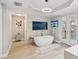 Spa-like bathroom with soaking tub, modern fixtures, and elegant wall art at 595 5Th Ne Ave, St Petersburg, FL 33701