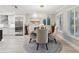 Elegant dining room with round table and neutral colored chairs at 595 5Th Ne Ave, St Petersburg, FL 33701