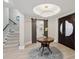 Grand entryway with double doors, circular table, and elegant chandelier at 595 5Th Ne Ave, St Petersburg, FL 33701