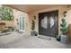 Welcoming entryway with double doors, potted plants, and brick walkway at 595 5Th Ne Ave, St Petersburg, FL 33701