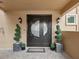 Elegant double front doors with circular window and potted plants at 595 5Th Ne Ave, St Petersburg, FL 33701