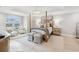 Luxurious main bedroom with a four poster bed, sitting area, and large window at 595 5Th Ne Ave, St Petersburg, FL 33701