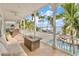 Outdoor patio overlooking the water with seating at 644 Boca Ciega Isle Dr, St Pete Beach, FL 33706