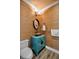 Unique powder room with a bamboo wall and vintage vanity at 644 Boca Ciega Isle Dr, St Pete Beach, FL 33706