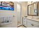 Small bathroom with a walk-in shower and white vanity at 644 Boca Ciega Isle Dr, St Pete Beach, FL 33706